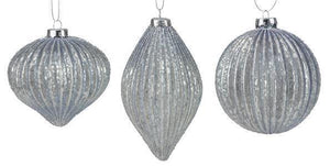 Image of a ball, elongated oval and onion Christmas ornaments with a ribbed surface and pale blue color